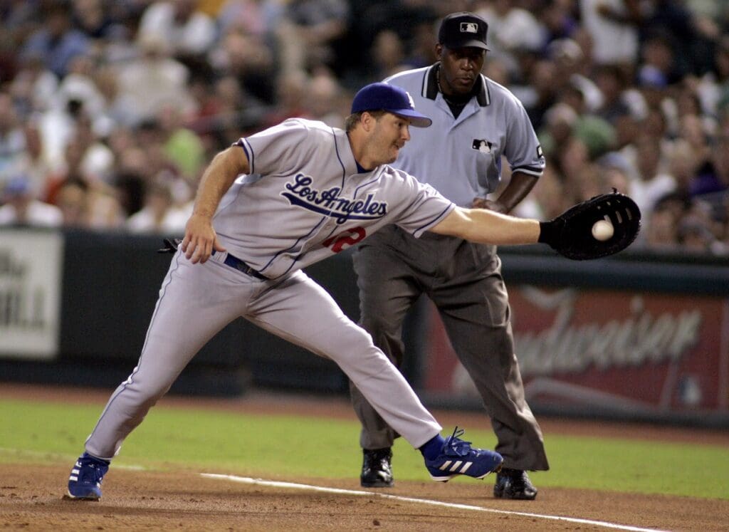 Aug 27, 2006; Phoenix, AZ, USA; Los Angeles Dodgers first baseman (12) Jeff Kent fields a ball for an out against the Arizona Diamondbacks at Chase Field.