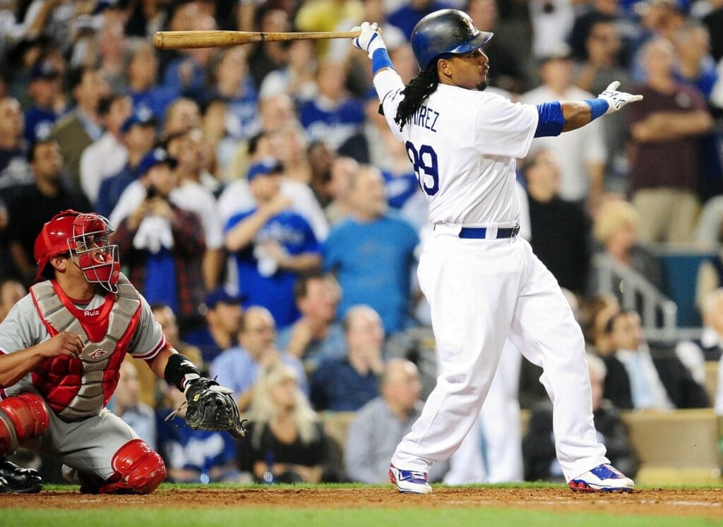 October 15, 2009; Los Angeles, CA, USA; Los Angeles Dodgers left fielder Manny Ramirez (99) hits a three run home run in the fifth inning against the Philadelphia Phillies during game one of the 2009 NLCS at Dodger Stadium.