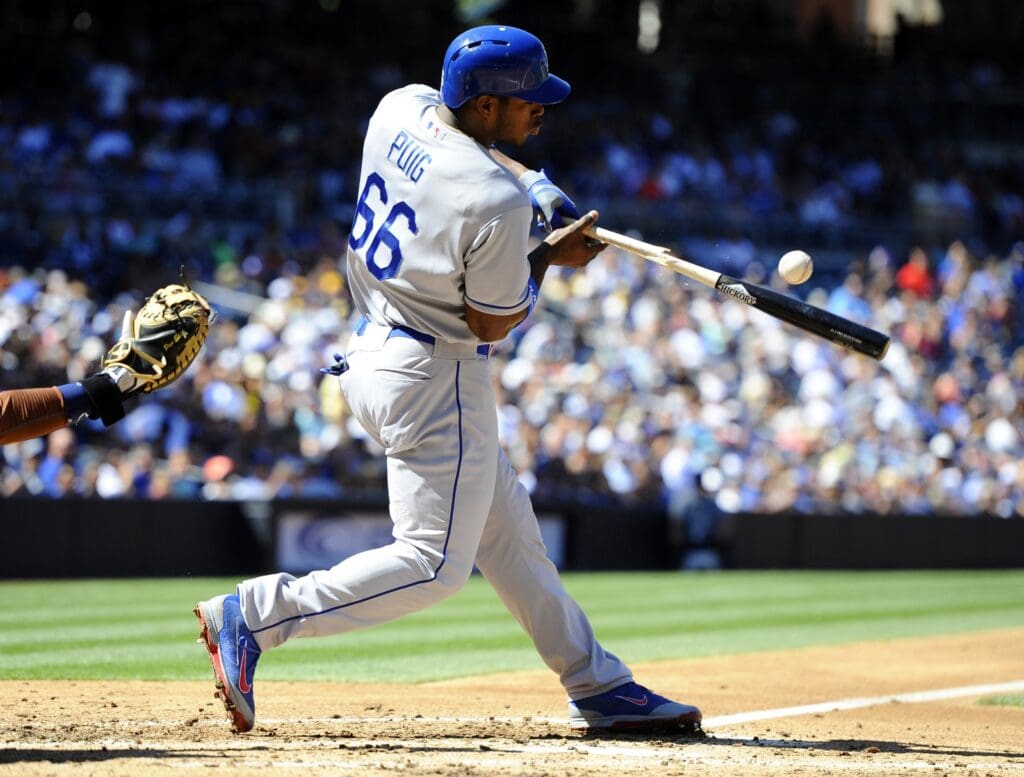 Sep 22, 2013; San Diego, CA, USA; Los Angeles Dodgers right fielder Yasiel Puig (66) breaks his bat on an infield out during the third inning against the San Diego Padres at Petco Park.