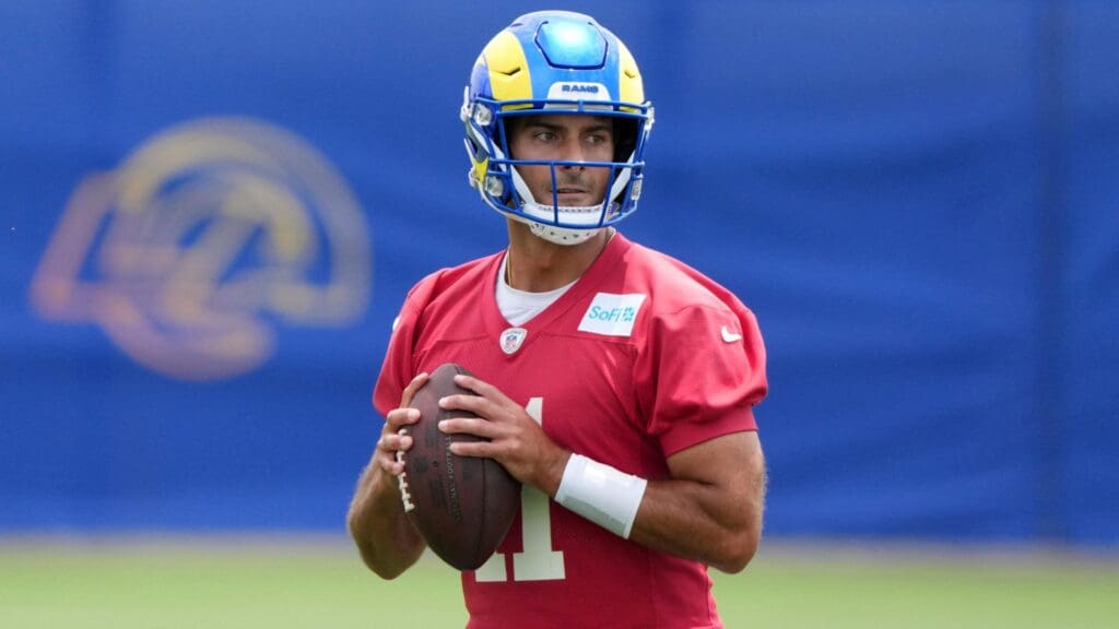 Jun 3, 2025; Woodland Hills, CA, USA; Los Angeles Rams quarterback Jimmy Garoppolo (11) throws the ball during organized team activities at Rams Practice Facility.