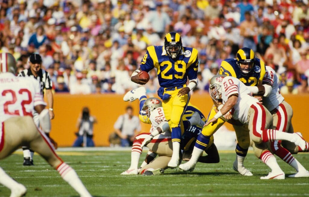 Sep 14, 1986; Anaheim ,CA, USA; FILE PHOTO; Los Angeles Rams running back Eric Dickerson (29) carries the ball against the San Francisco 49ers at Anaheim Stadium.
