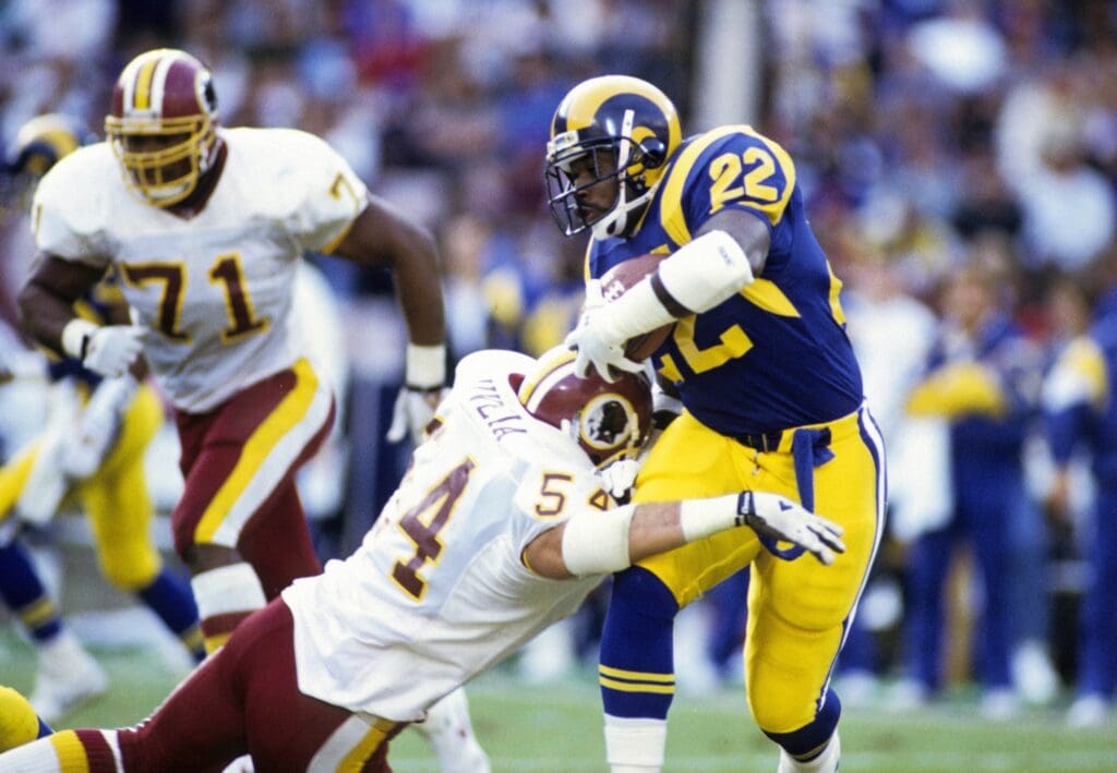 Los Angeles Rams running back Marcus Dupree (22) carries the ball against the Washington Redskins at Anaheim Stadium.