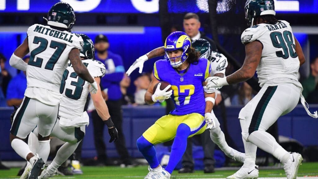 Nov 24, 2024; Inglewood, California, USA; Los Angeles Rams wide receiver Puka Nacua (17) runs the ball against Philadelphia Eagles cornerback Cooper DeJean (33) cornerback Quinyon Mitchell (27) and defensive tackle Jalen Carter (98) during the second half at SoFi Stadium.