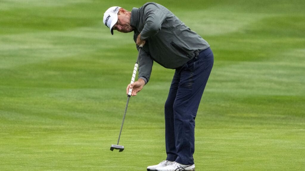 February 1, 2025; Pebble Beach, California, USA; Lucas Glover putts on the 15th hole during the third round of the AT&T Pebble Beach Pro-Am golf tournament at Pebble Beach Golf Links.