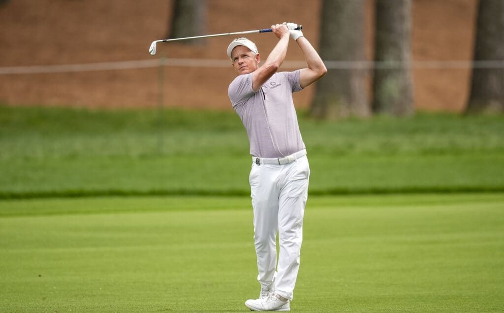 May 16, 2025; Charlotte, North Carolina, USA; Luke Donald hits his second shot on the second hole during the second round of the PGA Championship golf tournament at Quail Hollow.