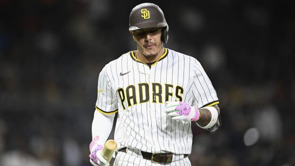 Jun 23, 2025; San Diego, California, USA; San Diego Padres third baseman Manny Machado (13) heads back to the dugout after hitting a fly ball during the ninth inning against the Washington Nationals at Petco Park.
