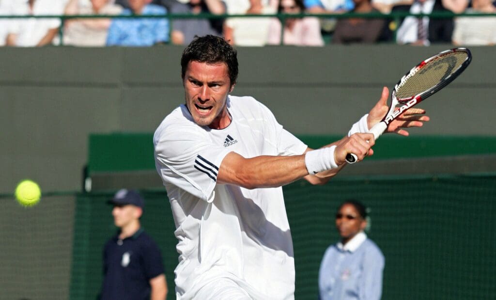 Jul 2, 2008; London, ENGLAND; Marat Safin (RUS) returns a shot against Feliciano Lopez (not pictured) during the quarter finals of the 2008 Wimbledon Championships at the All England Lawn and Tennis Club. Safin defeated Lopez 3-6, 7-5, 7-6, 6-3
