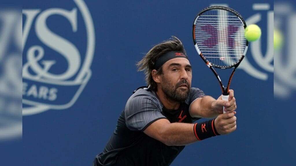 Aug 11, 2018; Mason, OH, USA; Marcos Baghdatis (CYP) returns a shot against Feliciano Lopez (ESP) in the Western and Southern tennis open at Lindner Family Tennis Center.