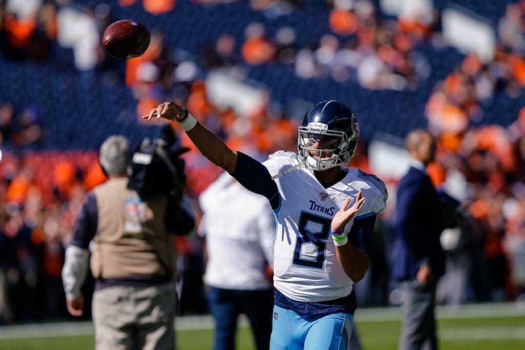 Oct 13, 2019; Denver, CO, USA; Tennessee Titans quarterback Marcus Mariota (8) warms up before the game against the Denver Broncos at Empower Field at Mile High