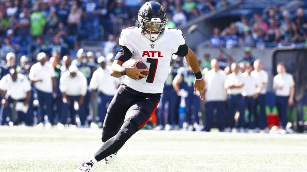 Sep 25, 2022; Seattle, Washington, USA; Atlanta Falcons quarterback Marcus Mariota (1) rushes for a touchdown against the Seattle Seahawks during the first quarter at Lumen Field.