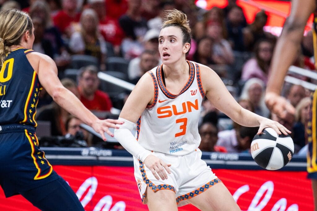 Jun 17, 2025; Indianapolis, Indiana, USA; Connecticut Sun guard Marina Mabrey (3) dribbles the ball while Indiana Fever guard Lexie Hull (10) defends in the second half at Gainbridge Fieldhouse.