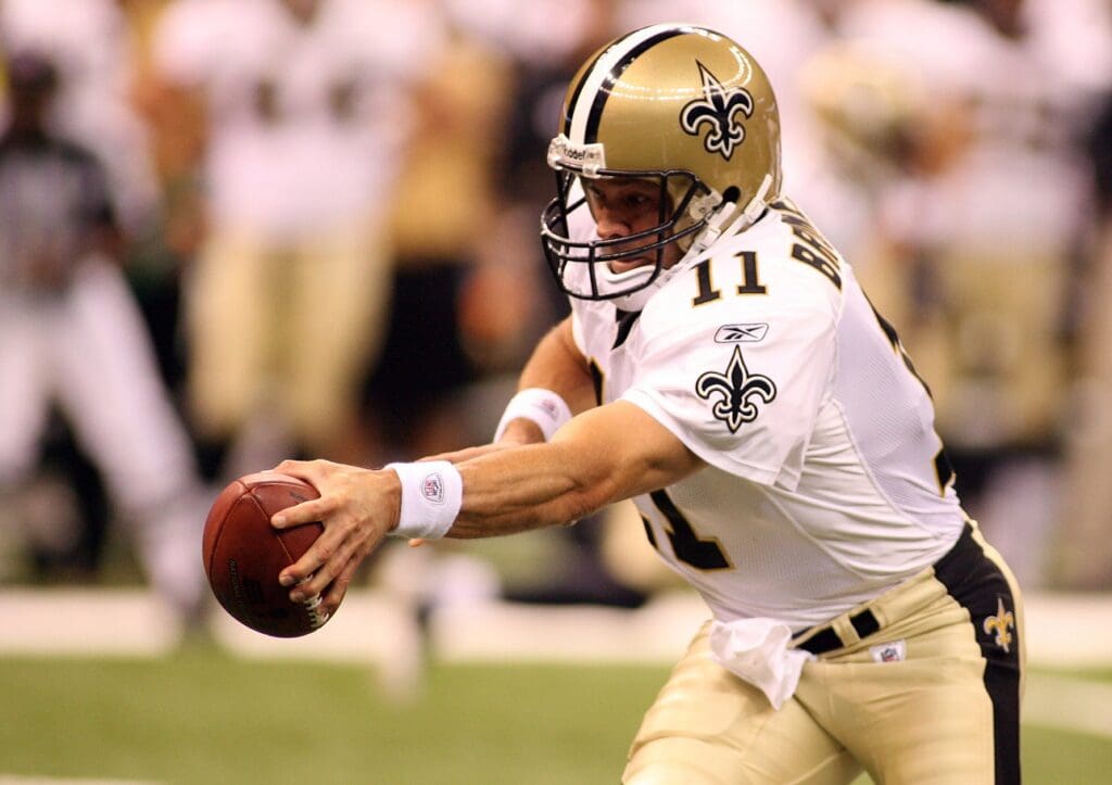 September 3, 2009; New Orleans, LA, USA; New Orleans Saints quarterback Mark Brunell (11) rolls back to hand off against the Miami Dolphins during 1st quarter their preseason game at the Louisiana Superdome.