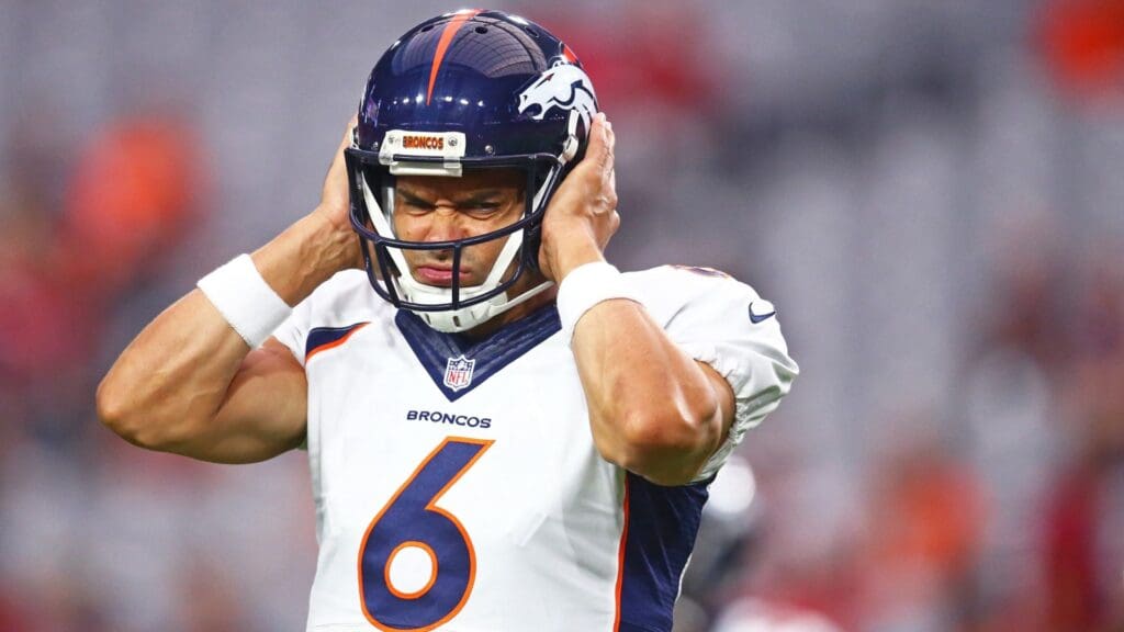 Denver Broncos quarterback Mark Sanchez (6) reacts against the Arizona Cardinals during a preseason game at University of Phoenix Stadium.
