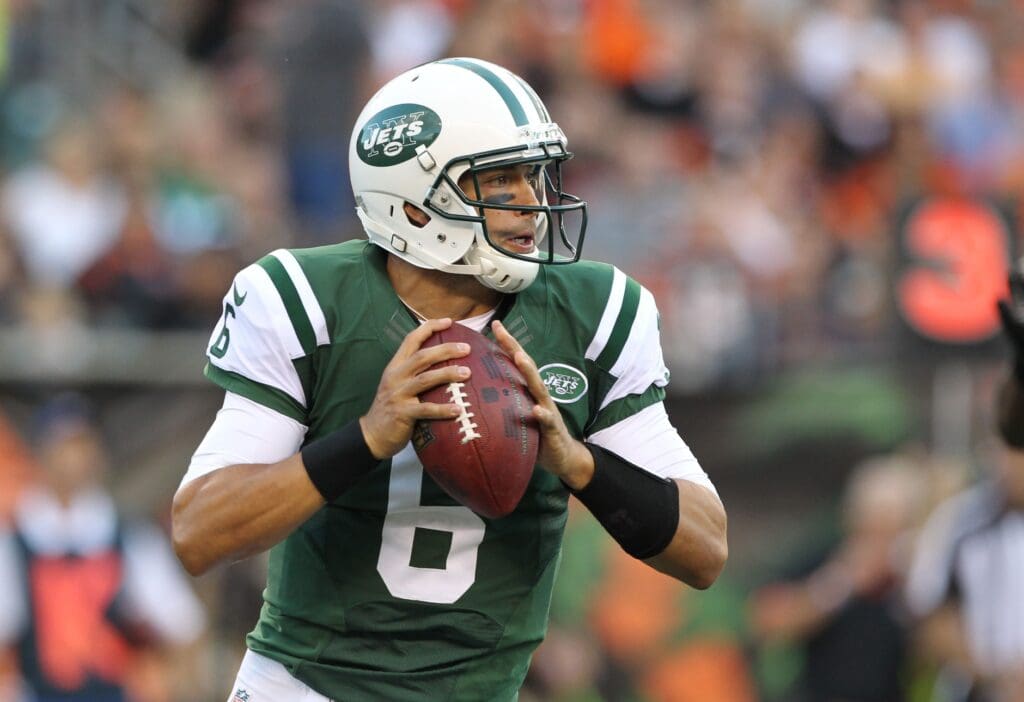 Aug 10, 2012; Cincinnati, OH, USA; New York Jets quarterback Mark Sanchez (6) rolls out of the pocket in the first quarter against the Cincinnati Bengals at Paul Brown Stadium.