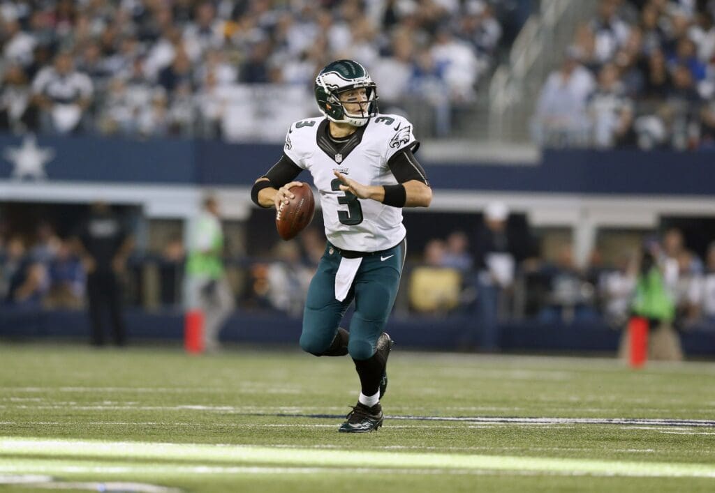 Nov 27, 2014; Arlington, TX, USA; Philadelphia Eagles quarterback Mark Sanchez (3) rolls out of the pocket against the Dallas Cowboys at AT&T Stadium.