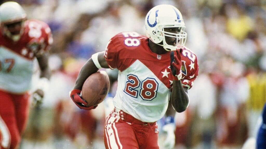 Feb 5, 1995; Honolulu, HI, USA; FILE PHOTO; Indianapolis Colts running back Marshall Faulk (28) carries the ball during the 1995 Pro Bowl at Aloha Stadium. During this game Faulk rushed for a record setting 180 yards.