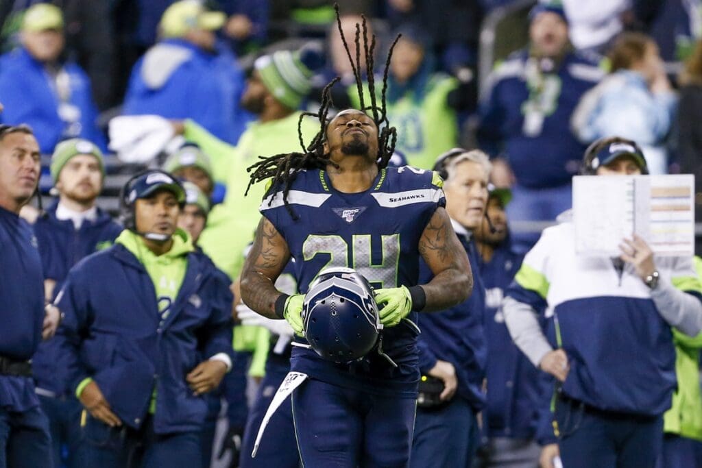 Dec 29, 2019; Seattle, Washington, USA; Seattle Seahawks running back Marshawn Lynch (24) puts on his helmet during the fourth quarter against the San Francisco 49ers at CenturyLink Field.