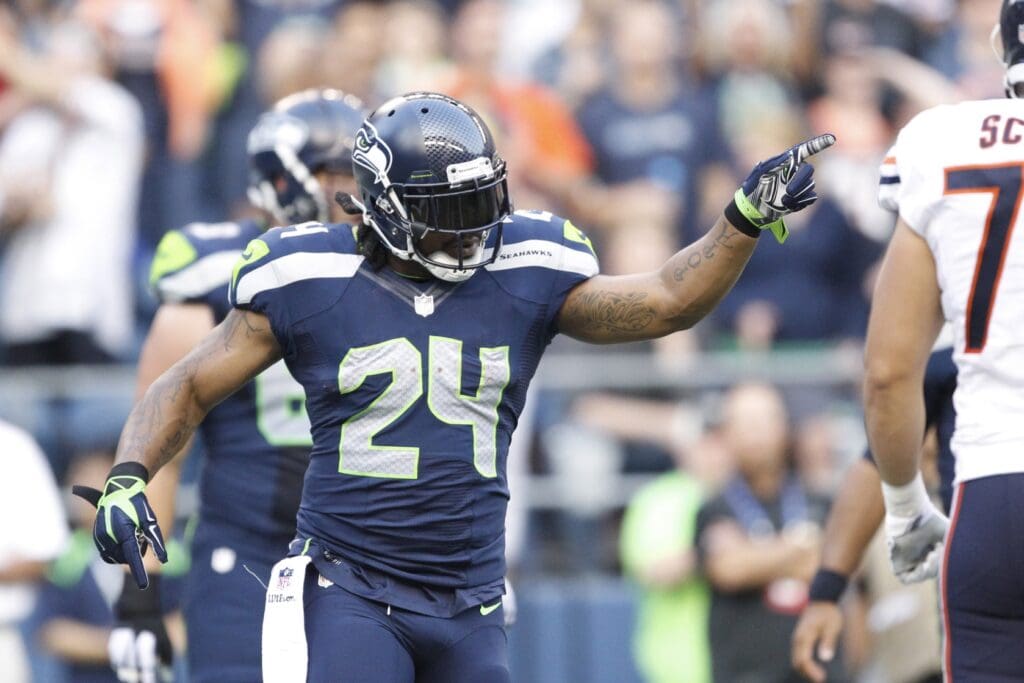 Aug 22, 2014; Seattle, WA, USA; Seattle Seahawks running back Marshawn Lynch (24) celebrates a touchdown run against the Chicago Bears during the first quarter at CenturyLink Field.
