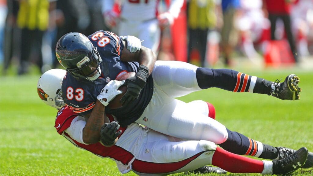 Sep 20, 2015; Chicago, IL, USA; Chicago Bears tight end Martellus Bennett (83) makes a catch and is tackled by Arizona Cardinals strong safety Tony Jefferson (22) during the first half at Soldier Field.