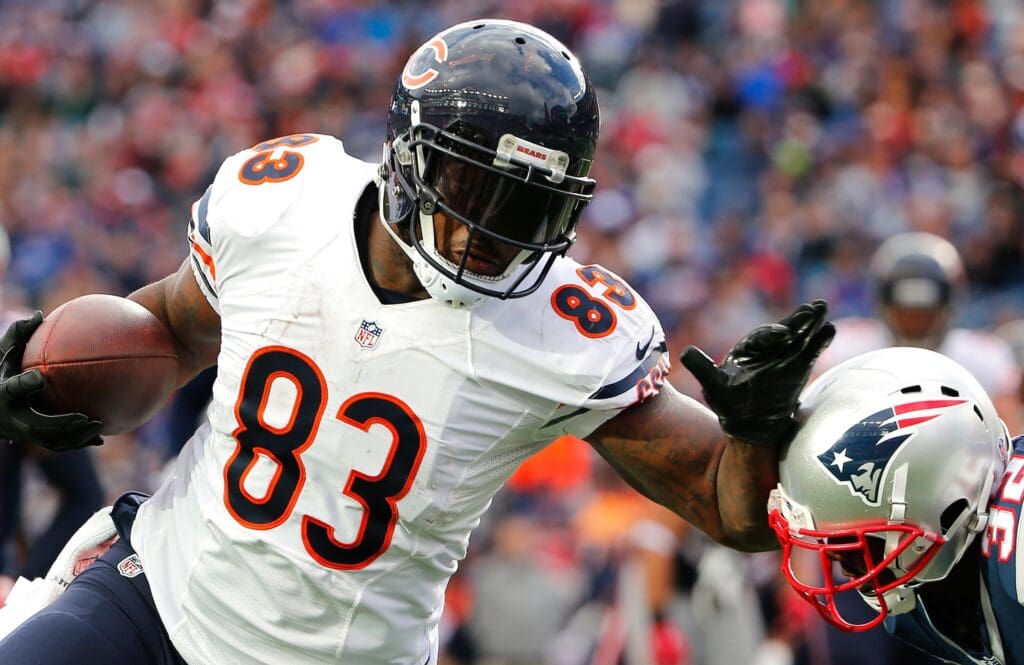 Oct 26, 2014; Foxborough, MA, USA; Chicago Bears tight end Martellus Bennett (83) tries to fend off New England Patriots free safety Devin McCourty (32) during the second half of New England's 51-23 win at Gillette Stadium