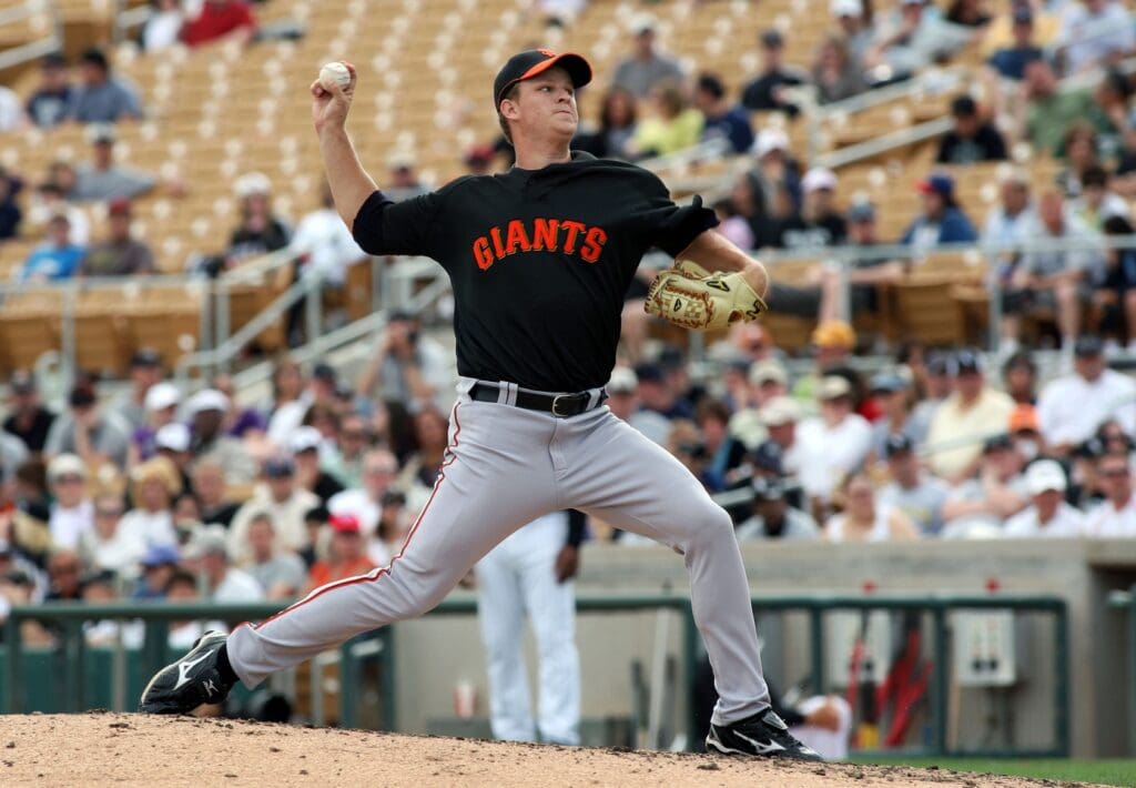 March 23, 2010; Glendale, AZ, USA; San Francisco Giants pitcher Matt Cain (18) delivers a pitch during the sixth inning at the Camelback Ranch.