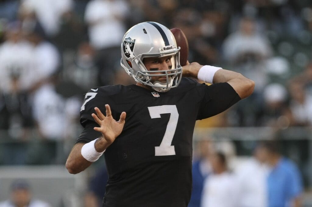 September 10, 2012; Oakland CA, USA; Oakland Raiders quarterback Matt Leinart (7) warms up before the game against the San Diego Chargers at O.co Coliseum
