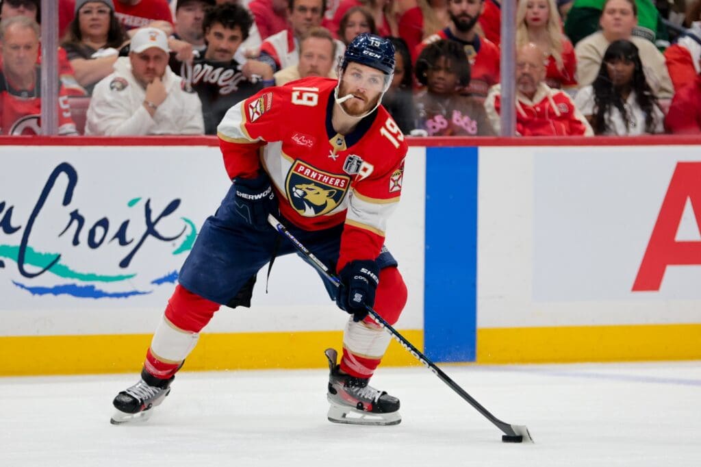 Jun 17, 2025; Sunrise, Florida, USA; Florida Panthers left wing Matthew Tkachuk (19) controls the puck against the Edmonton Oilers during the second period in game six of the 2025 Stanley Cup Final at Amerant Bank Arena.