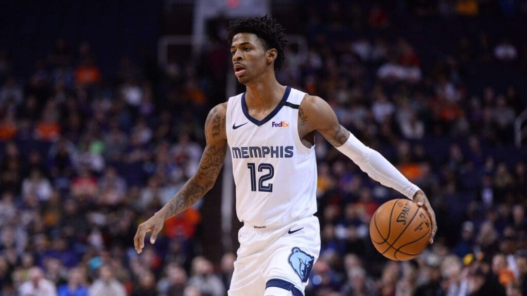 Jan 5, 2020; Phoenix, Arizona, USA; Memphis Grizzlies guard Ja Morant (12) dribbles against the Phoenix Suns during the first half at Talking Stick Resort Arena.