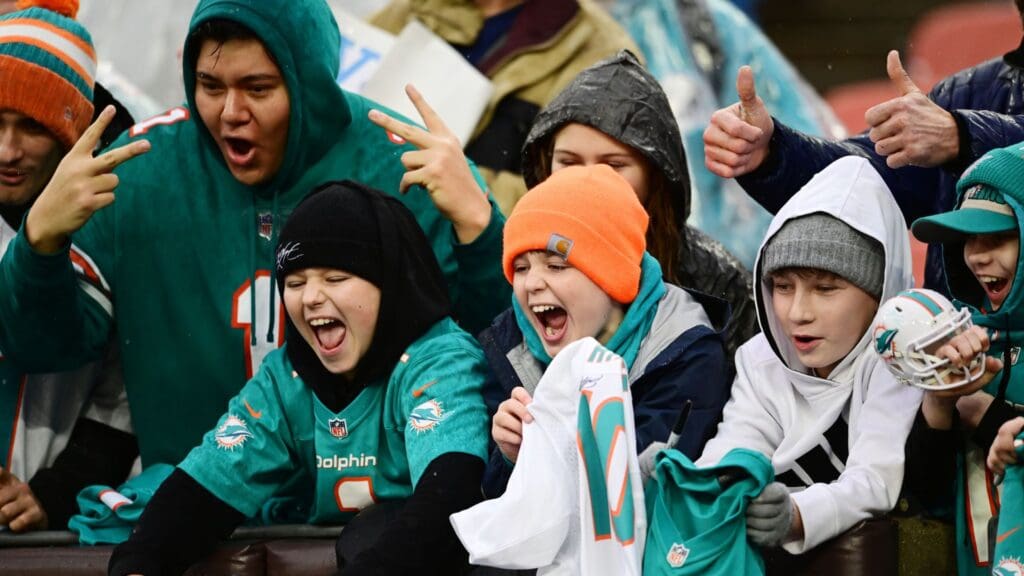 Dec 29, 2024; Cleveland, Ohio, USA; A Miami Dolphins fans cheer for their team before the game between the Cleveland Browns and the Dolphins at Huntington Bank Field.
