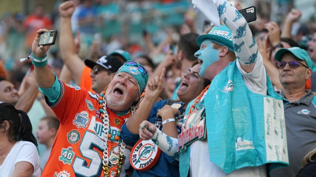 Miami Dolphins fans celebrate making the playoffs after an 11-6 victory over the New York Jets at Hard Rock Stadium in Miami Gardens, Jan. 8, 2023.