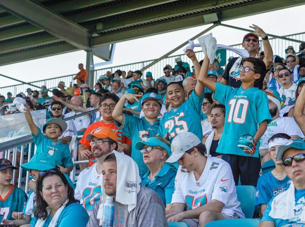 Miami Dolphins fans cheer at training camp at Baptist Health Training Complex, Sunday, July 30, 2023 in Miami Gardens.