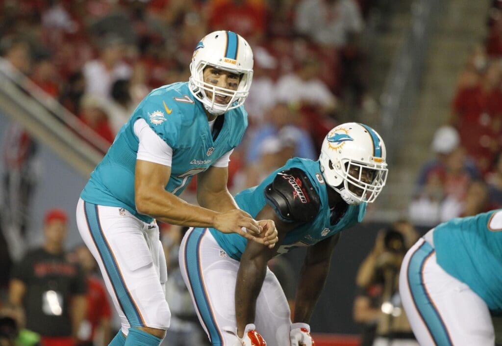 Aug 16, 2014; Tampa, FL, USA; Miami Dolphins quarterback Brady Quinn (7) calls a play during the second half against the Tampa Bay Buccaneers at Raymond James Stadium. Miami won 20-14.