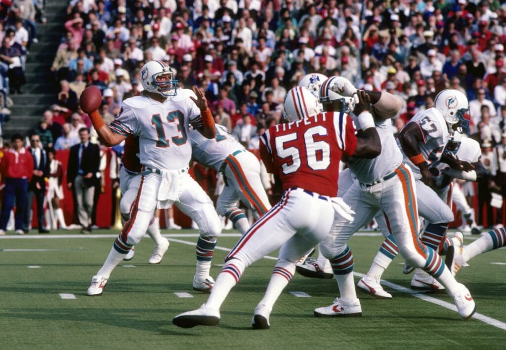 Oct 21, 1984; Foxboro, MA, USA: FILE PHOTO; Miami Dolphins quarterback Dan Marino (13) in action against the New England Patriots at Foxboro Stadium.
