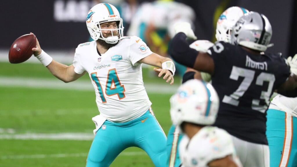 Dec 26, 2020; Paradise, Nevada, USA; Miami Dolphins quarterback Ryan Fitzpatrick (14) throws against the Las Vegas Raiders during the second half at Allegiant Stadium.
