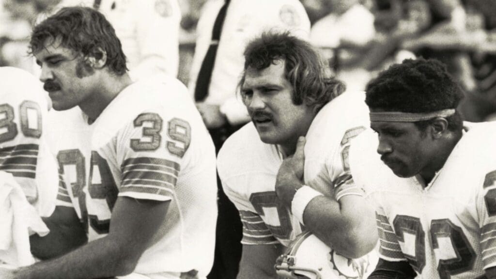 Nov 19, 1972; Miami, FL, USA; FILE PHOTO; Miami Dolphins running backs Larry Csonka (39), Jim Kiick (21), and Mercury Morris (22) on the bench against the New York Jets at the Orange Bowl. Miami defeated New York 28-24