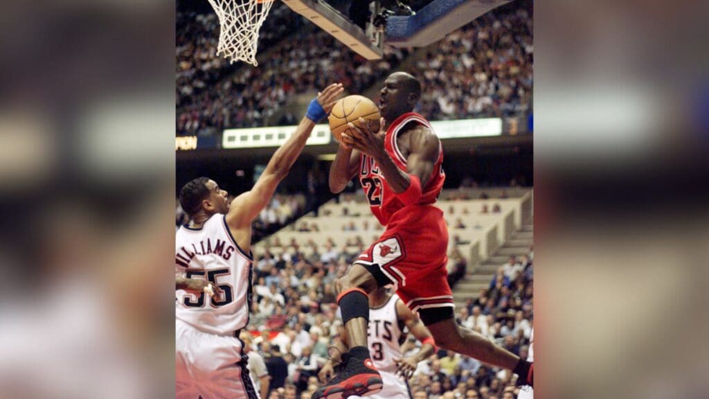 April 29, 1998; Chicago, IL, USA; Bulls Michael Jordan moves past nets #55 Jayson Williams in the second half.