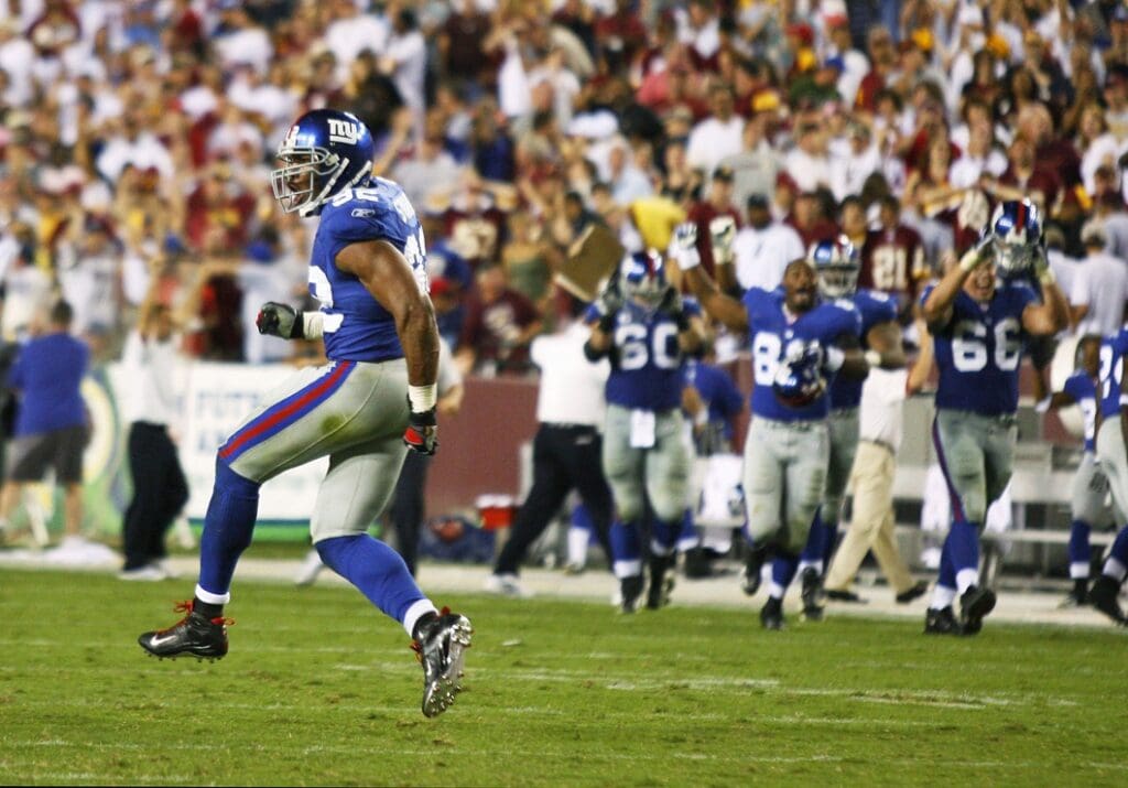 Sept 23, 2007; Landover, MD, USA; New York Giants defensive end Michael Strahan (92) celebrates his defense's goal line stand on fourth down in the final seconds of the Giants 24-17 win over the Washington Redskins at FedEx Field in Landover, MD.
