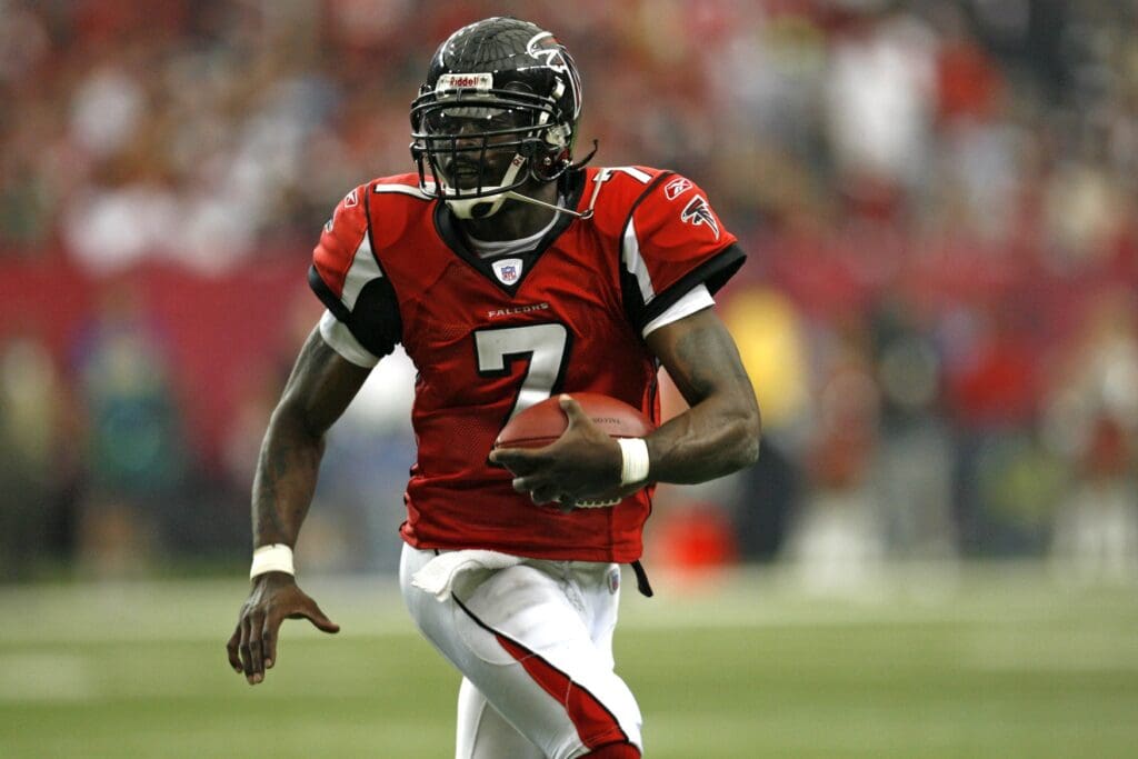 Oct 1, 2006; Atlanta, GA, USA; Atlanta Falcons quarterback (7) Michael Vick runs with the football against the Arizona Cardinals in the second half at the Georgia Dome. The Falcons defeated the Cardinals 32 to 10.