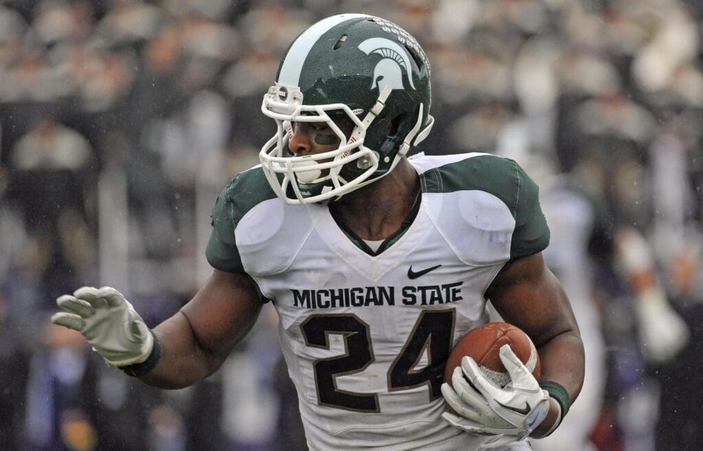 Nov 26, 2011; Evanston, IL, USA; Michigan State Spartans running back Le'Veon Bell (24) rushes the ball against the Northwestern Wildcats during the second half at Ryan Field. Michigan State defeats Northwestern 31-17.