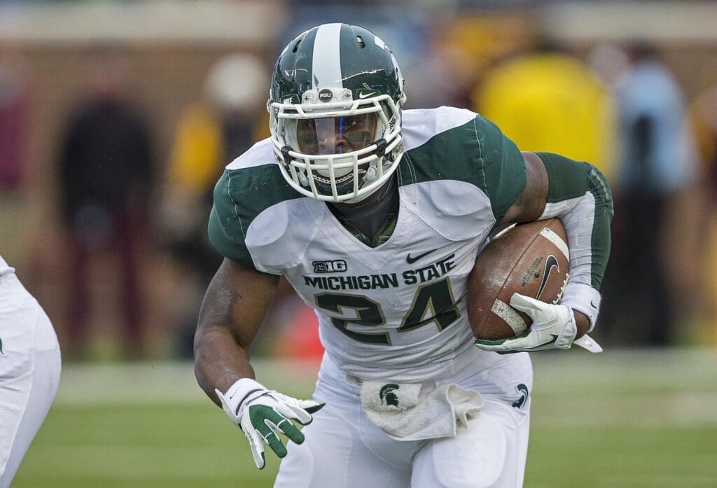 Nov 24, 2012; Minneapolis, MN, USA: Michigan State Spartans running back Le'Veon Bell (24) runs for a first down in the first half against the Minnesota Golden Gophers at TCF Bank Stadium.