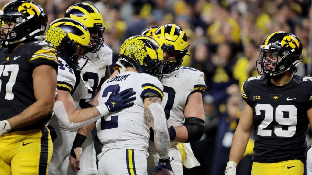 Dec 2, 2023; Indianapolis, IN, USA; Michigan Wolverines running back Blake Corum (2) celebrates with teammates after scoring a touchdown during the second half of the Big Ten Championship game against the Iowa Hawkeyes at Lucas Oil Stadium.