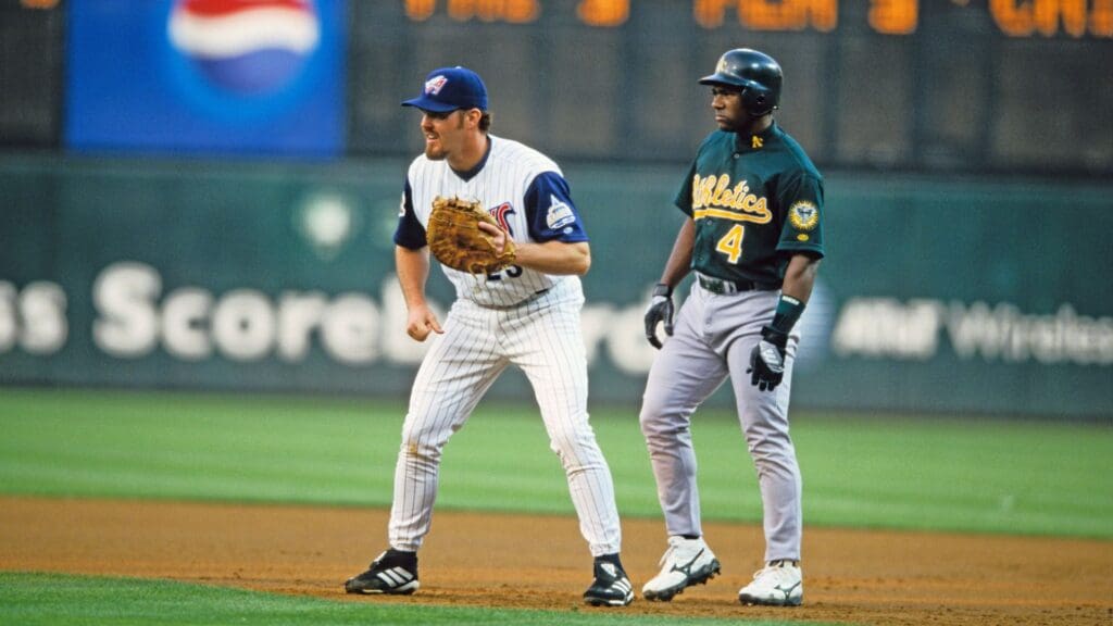 Jul 17, 2001; Anaheim, CA, USA; FILE PHOTO; Anaheim Angels first baseman Scott Spiezio (23) on the field against Oakland Athletics shortstop Miguel Tejada (4) at Edison Field.