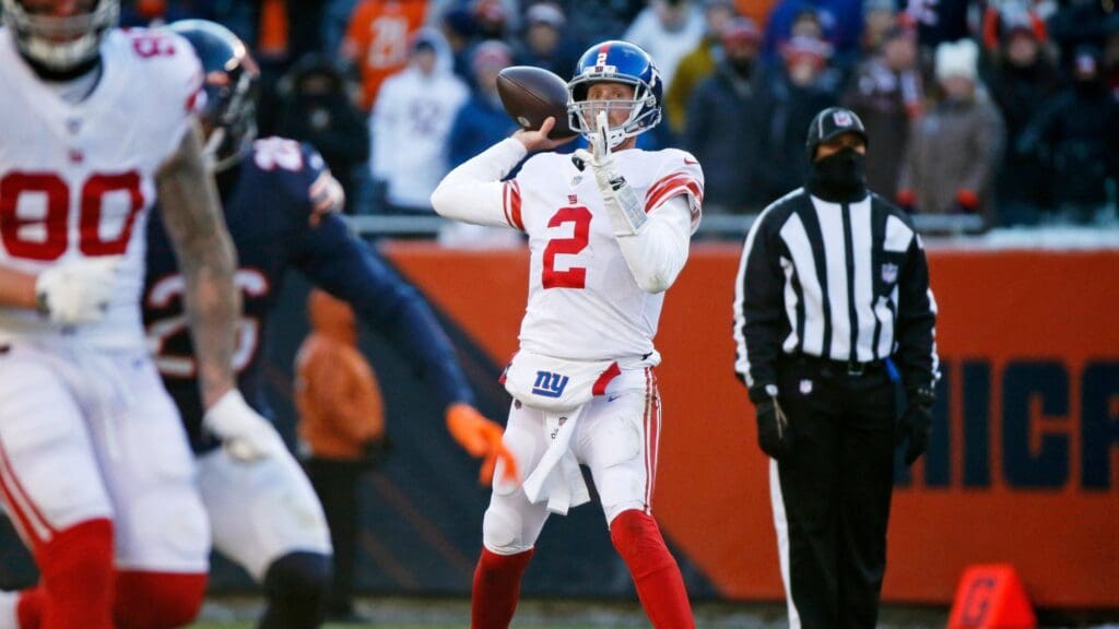 Jan 2, 2022; Chicago, Illinois, USA; New York Giants quarterback Mike Glennon (2) passes the ball against the Chicago Bears during the second half at Soldier Field.