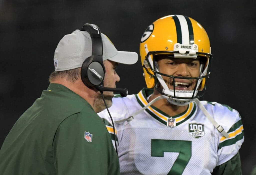 Aug 24, 2018; Oakland, CA, USA; Green Bay Packers head coach Mike McCarthy talks with quarterback Brett Hundley (7) during a preseason game against the Oakland Raiders at Oakland-Alameda County Coliseum.