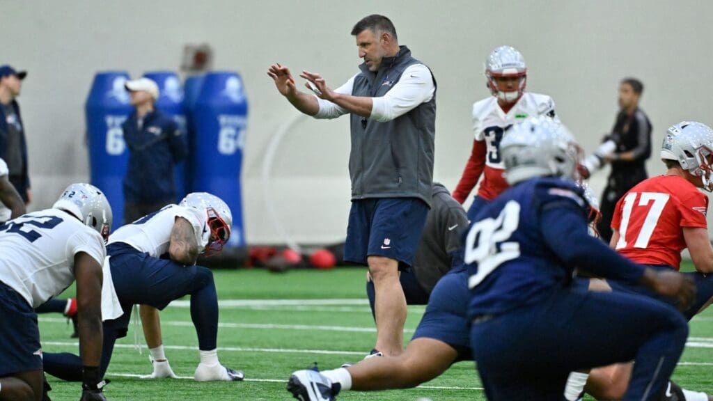 May 9, 2025; Foxborough, MA, USA; New England Patriots head coach Mike Vrabel (c) works with players at rookie camp at Gillette Stadium.