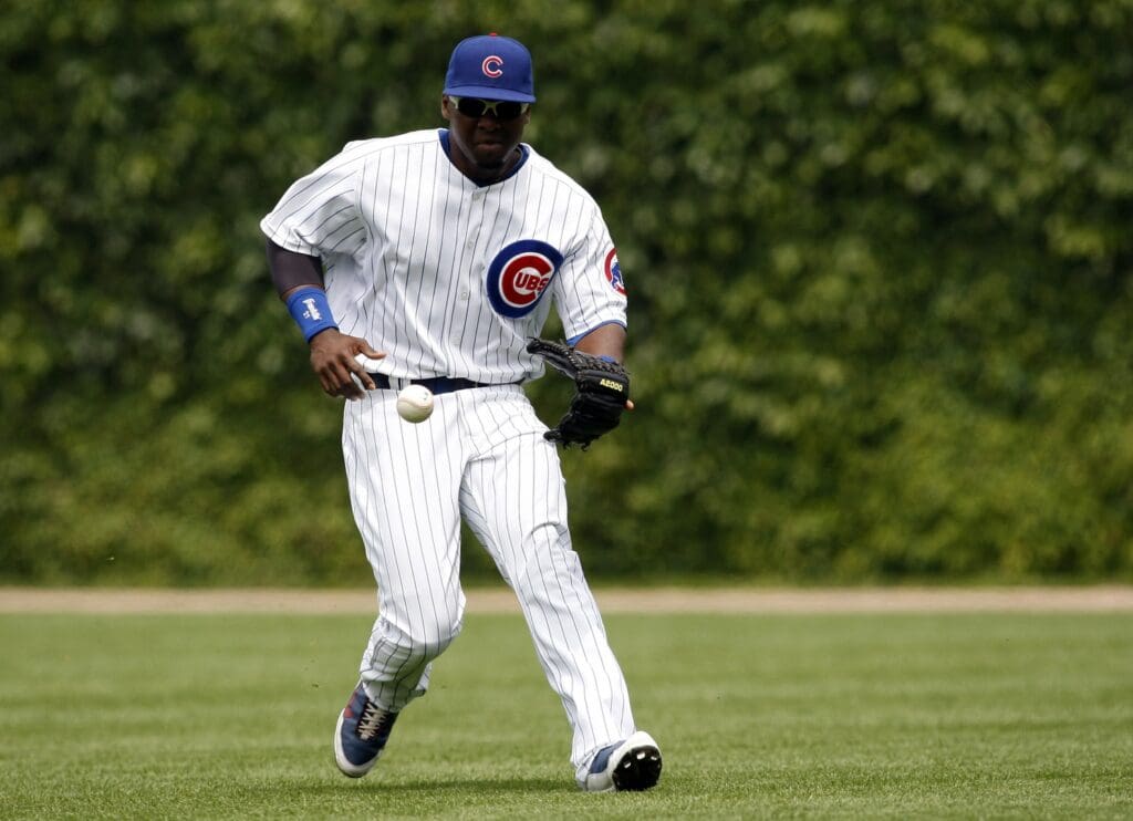 Jun 17, 2009; Chicago, IL, USA; Chicago Cubs right fielder Milton Bradley (21) fields a ball during the second inning against the Chicago White Sox at Wrigley Field. The White Sox won 4-1.