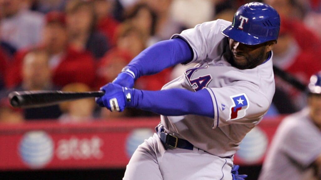 April 4, 2008; Anaheim CA, USA; Texas Rangers designated hitter Milton Bradley (21) hits a double in the fourth inning against the Los Angeles Angels at Angel Stadium of Anaheim