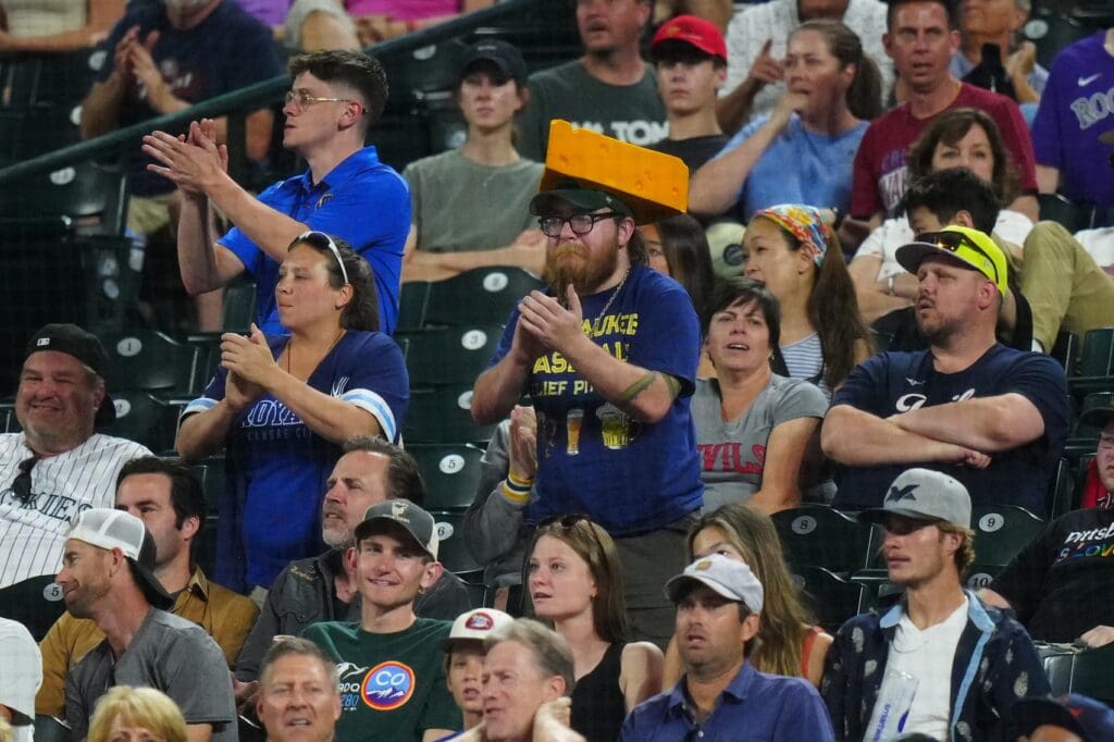 Jul 2, 2024; Denver, Colorado, USA; Milwaukee Brewers fans react to a score in the ninth inning against the Colorado Rockies at Coors Field.