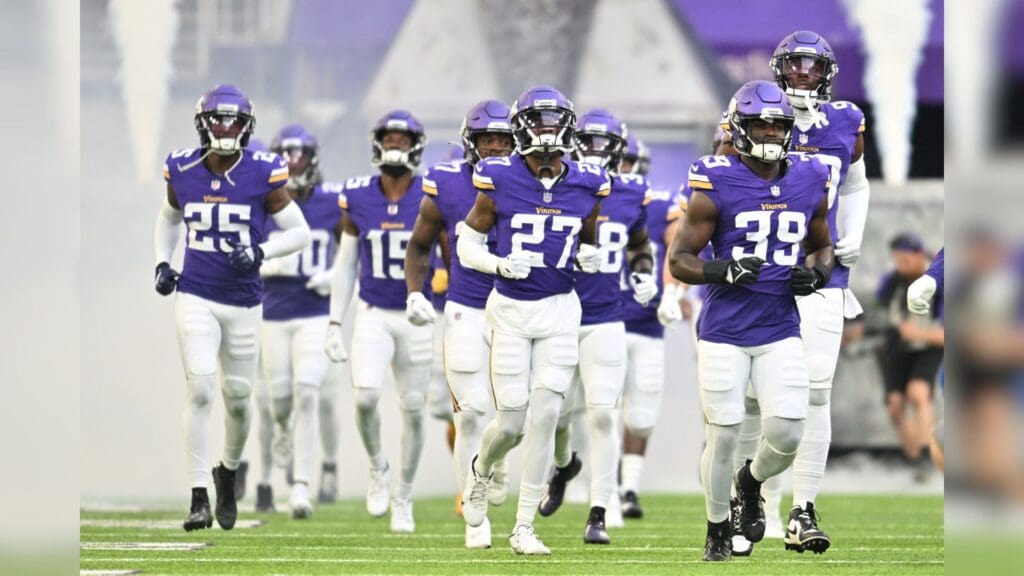 Aug 19, 2023; Minneapolis, Minnesota, USA; Minnesota Vikings linebacker Abraham Beauplan (39) and cornerback Kalon Barnes (27) and safety Theo Jackson (25) lead the team onto the field before the game against the Tennessee Titans at U.S. Bank Stadium.