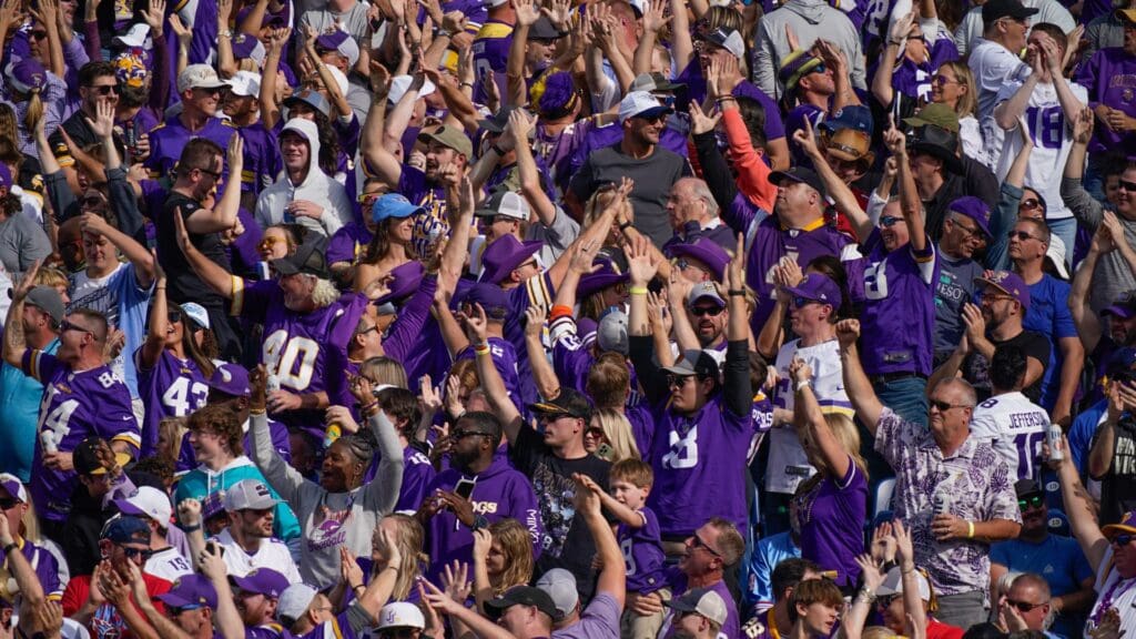 Minnesota Vikings fans celebrate a touchdown by wide receiver Jordan Addison (3) in the first quarter at Nissan Stadium in Nashville, Tenn., Sunday, Nov. 17, 2024.